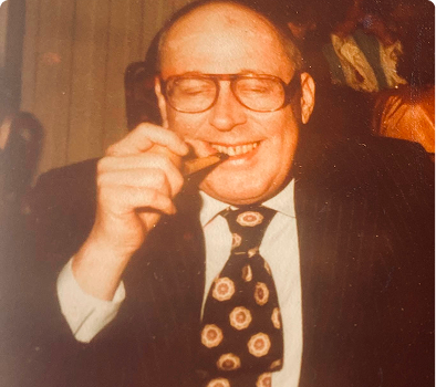 Happy man enjoying a cigar